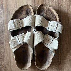 Birkenstock Arizona sandals on cream color